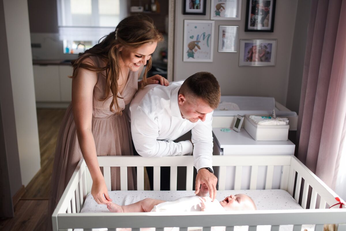 Chrzest święty — rodzice z niemowlęciem